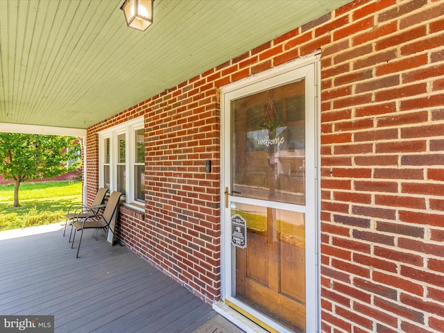 21127 Twin Springs Dr, Smithsburg, MD 21783 - doorway to property featuring a porch and brick siding