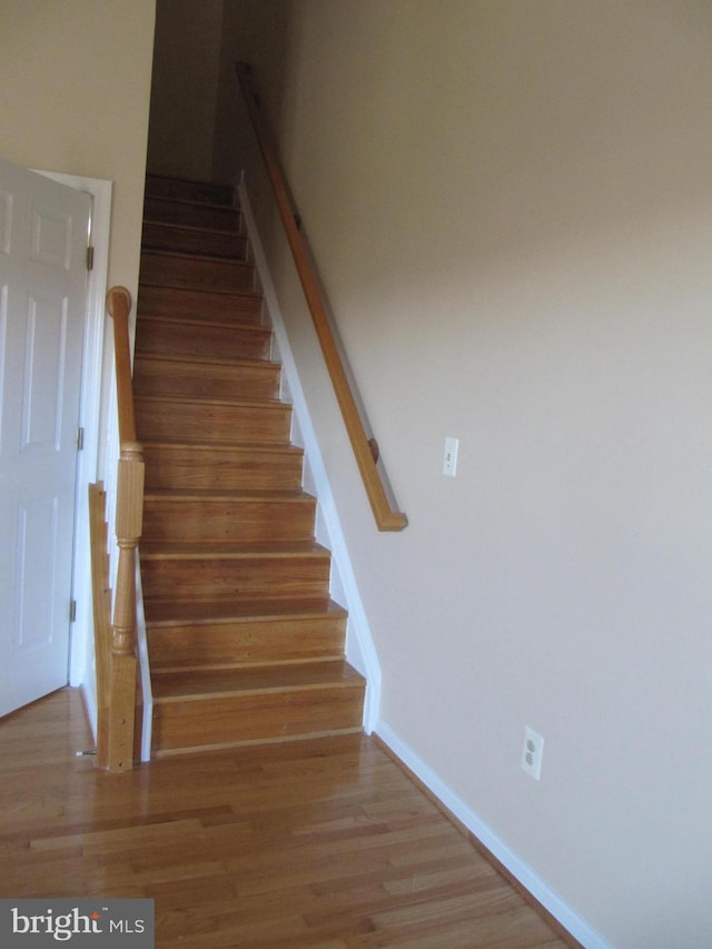 44035 Kings Arms Sq, Ashburn, VA 20147 - stairway featuring wood finished floors and baseboards