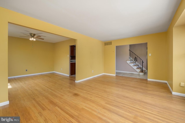 22 Clemson Rd, Cherry Hill, NJ 08034 - unfurnished room with a ceiling fan, light wood-style flooring, and stairs