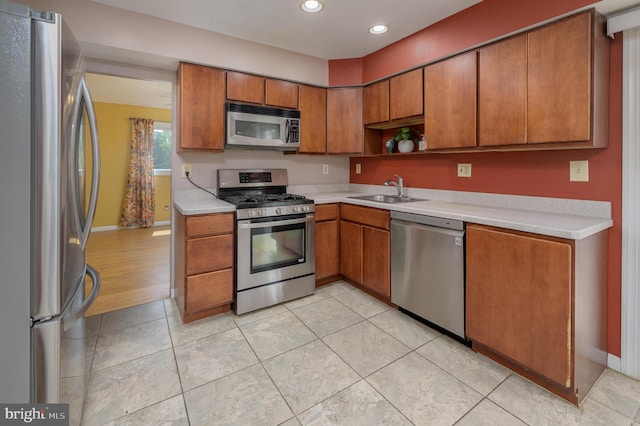 22 Clemson Rd, Cherry Hill, NJ 08034 - kitchen with appliances with stainless steel finishes, recessed lighting, light countertops, brown cabinetry, and open shelves