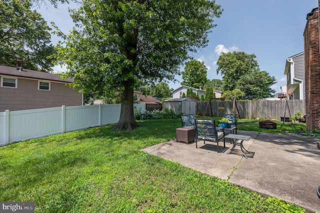 22 Clemson Rd, Cherry Hill, NJ 08034 - fenced backyard featuring a storage shed, a patio area, and an outdoor fire pit