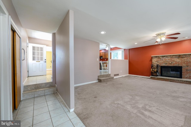 22 Clemson Rd, Cherry Hill, NJ 08034 - unfurnished living room with light carpet, light tile patterned floors, ceiling fan, a brick fireplace, and recessed lighting