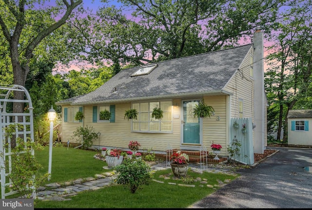 553 Kingfisher Crk, Brick, NJ 08723 - view of front facade with a chimney, a front lawn, a shingled roof, and driveway