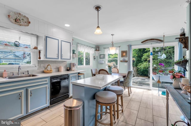553 Kingfisher Crk, Brick, NJ 08723 - kitchen featuring dishwasher, crown molding, light countertops, a breakfast bar, and pendant lighting