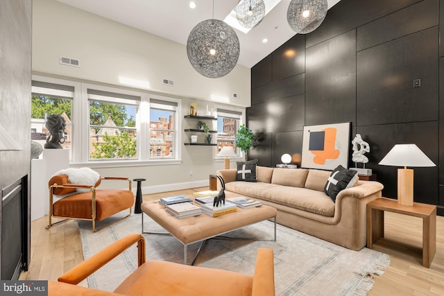 2431 Ontario Rd NW Unit 4, Washington, DC 20009 - living area with a high ceiling, light wood-style floors, and recessed lighting