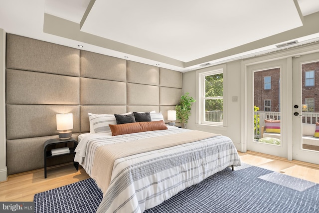2431 Ontario Rd NW Unit 4, Washington, DC 20009 - bedroom with access to outside, light wood-style flooring, and french doors