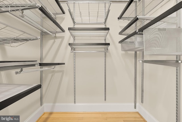 2431 Ontario Rd NW Unit 4, Washington, DC 20009 - walk in closet with wood finished floors
