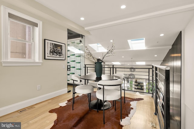 2431 Ontario Rd NW Unit 4, Washington, DC 20009 - dining room featuring a skylight, light wood-style floors, and recessed lighting