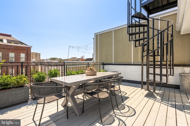 2431 Ontario Rd NW Unit 4, Washington, DC 20009 - wooden deck featuring stairway and outdoor dining space