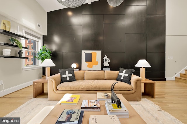 2431 Ontario Rd NW Unit 4, Washington, DC 20009 - living room with light wood-style floors and high vaulted ceiling