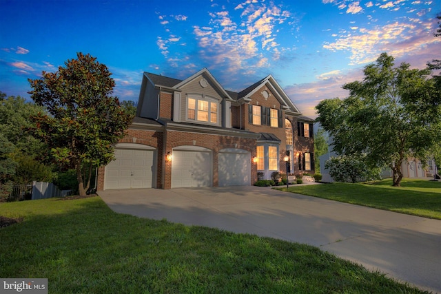 10102 Mike Rd, Fort Washington, MD 20744 - view of front of house with a garage, brick siding, concrete driveway, and a lawn