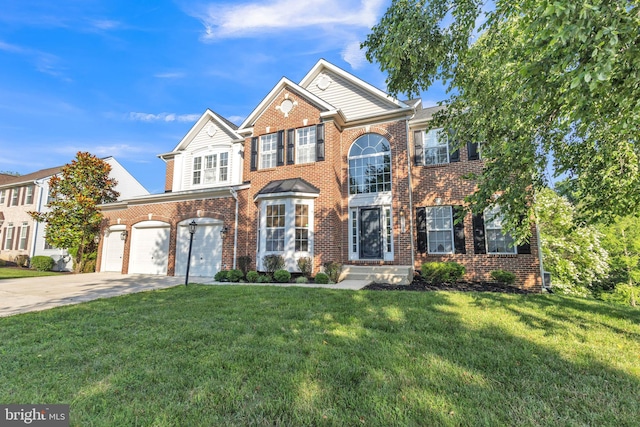 10102 Mike Rd, Fort Washington, MD 20744 - view of front facade with brick siding, concrete driveway, a front yard, and a garage