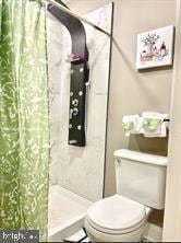 2647 N 17th St, Philadelphia, PA 19132 - bathroom with toilet and a shower with shower curtain