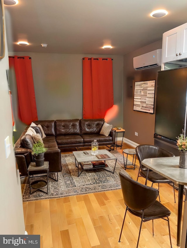 2647 N 17th St, Philadelphia, PA 19132 - living room with an AC wall unit and wood finished floors