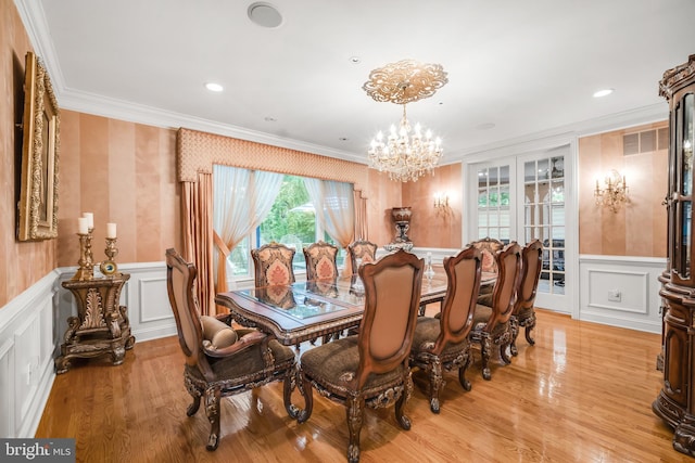1126 Timbergate Dr, Jenkintown, PA 19046 - dining space with a chandelier, ornamental molding, a decorative wall, wainscoting, and light wood-style floors