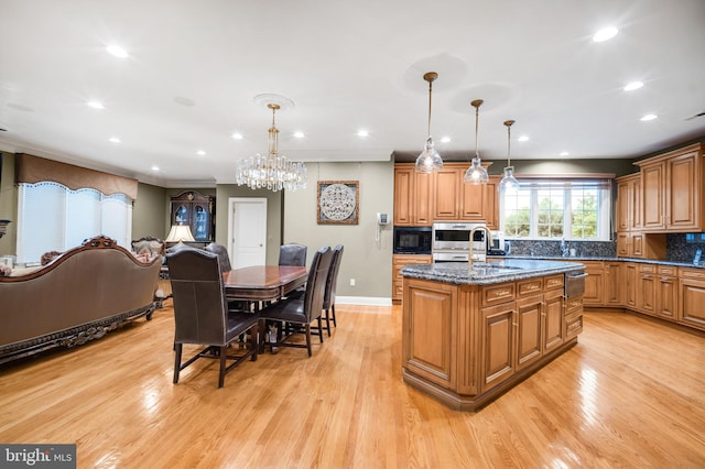 1126 Timbergate Dr, Jenkintown, PA 19046 - kitchen featuring black microwave, an island with sink, light wood finished floors, a chandelier, and recessed lighting
