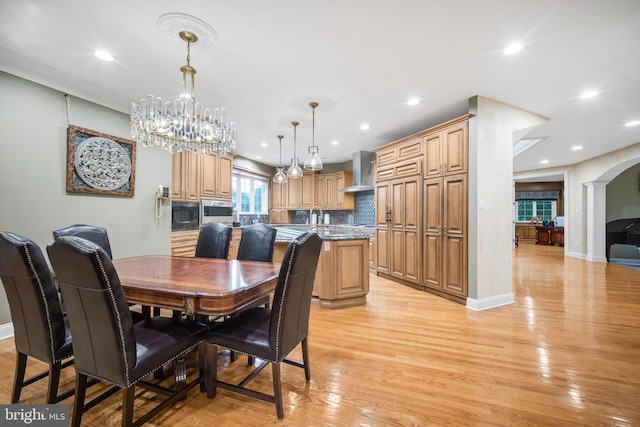 1126 Timbergate Dr, Jenkintown, PA 19046 - dining space with light wood-type flooring, arched walkways, recessed lighting, and a chandelier