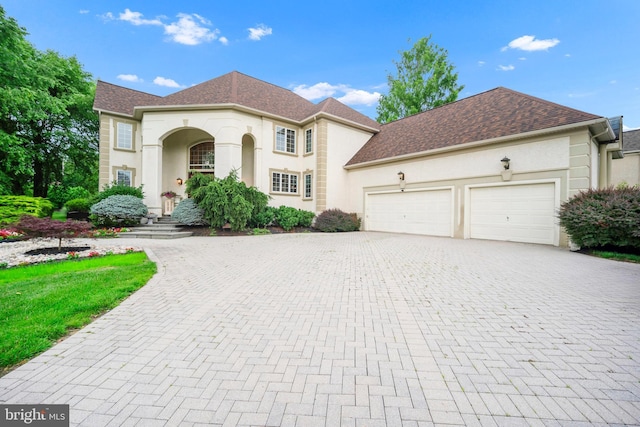 1126 Timbergate Dr, Jenkintown, PA 19046 - view of front of property featuring decorative driveway, an attached garage, stucco siding, and roof with shingles