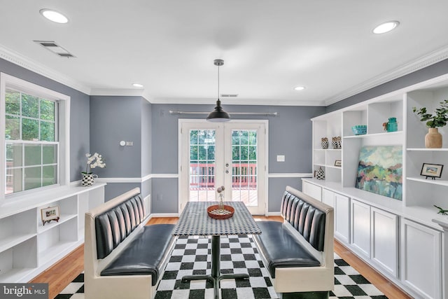 5722 Larpin Ln, Alexandria, VA 22310 - dining area with french doors, light wood-style flooring, crown molding, and recessed lighting