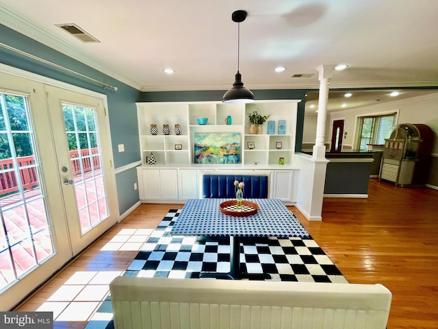 5722 Larpin Ln, Alexandria, VA 22310 - dining space featuring ornate columns, healthy amount of natural light, crown molding, light wood-style floors, and recessed lighting