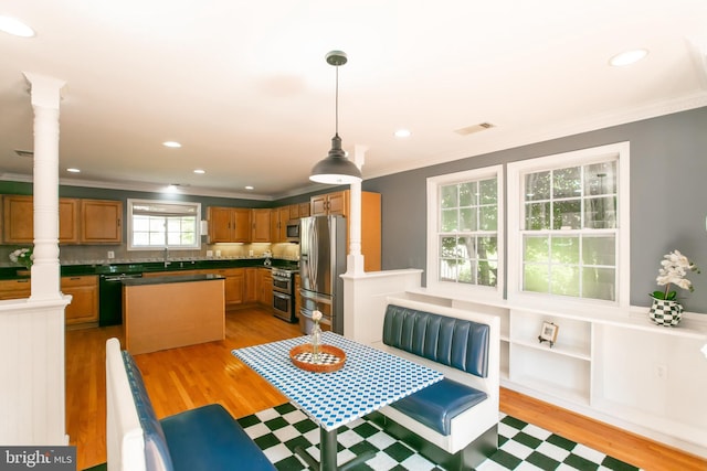 5722 Larpin Ln, Alexandria, VA 22310 - dining room with crown molding, light wood-style flooring, recessed lighting, and ornate columns