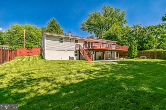 5722 Larpin Ln, Alexandria, VA 22310 - back of property with a deck, stairway, and a fenced backyard