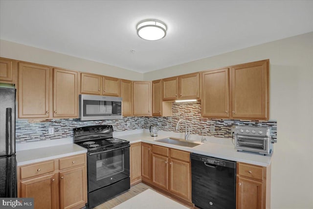 284 S Village Cir, Palmyra, PA 17078 - kitchen with black appliances, decorative backsplash, light countertops, and light brown cabinets