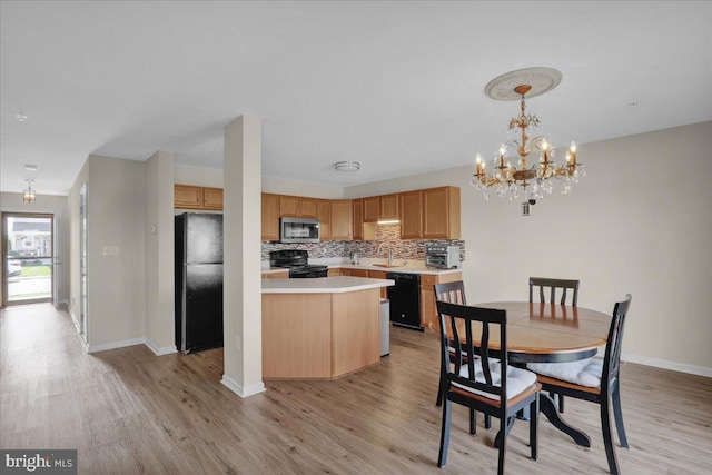 284 S Village Cir, Palmyra, PA 17078 - dining room with light wood-style flooring and a chandelier