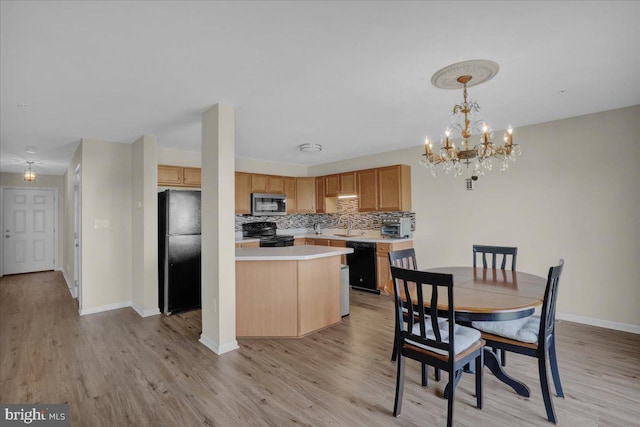284 S Village Cir, Palmyra, PA 17078 - dining room with light wood-type flooring and a chandelier