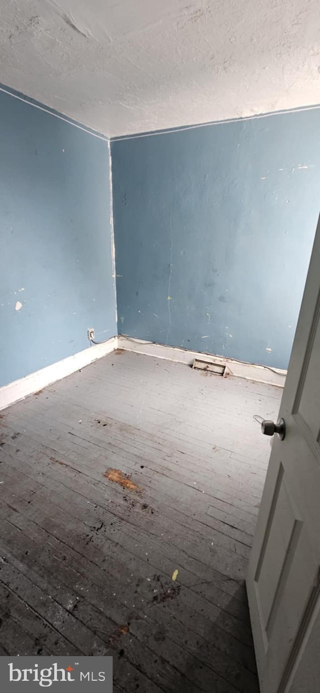 67 Vine St, Trenton, NJ 08638 - unfurnished room with a textured ceiling and baseboards