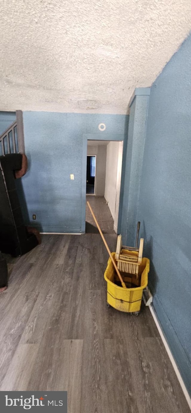 67 Vine St, Trenton, NJ 08638 - corridor with wood finished floors and a textured ceiling