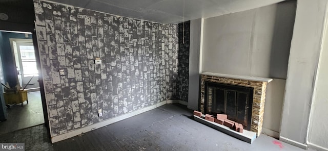 67 Vine St, Trenton, NJ 08638 - unfurnished living room featuring a glass covered fireplace and baseboards