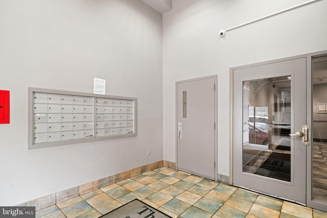 825 N 29th St Unit 5G, Philadelphia, PA 19130 - entryway with mail area, a towering ceiling, and stone finish floors