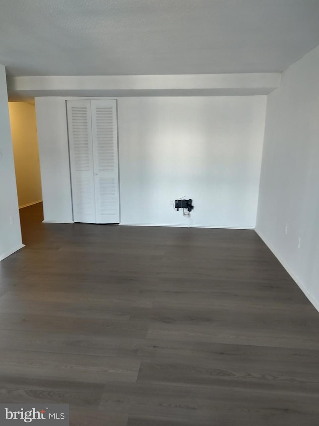 1301 Delaware Ave SW Unit N103, Washington, DC 20024 - empty room featuring dark wood-type flooring and baseboards
