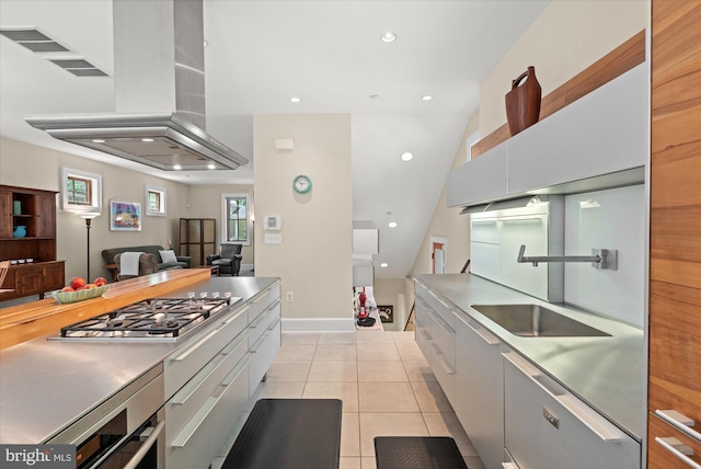 9 E Walnut St, Alexandria, VA 22301 - kitchen with island range hood, dishwasher, stainless steel gas cooktop, light tile patterned floors, and stainless steel countertops