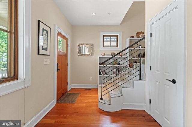 9 E Walnut St, Alexandria, VA 22301 - entryway featuring wood finished floors, stairway, and recessed lighting
