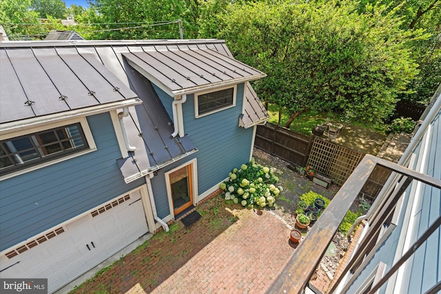 9 E Walnut St, Alexandria, VA 22301 - view of front of property with a standing seam roof, a metal roof, and an attached garage