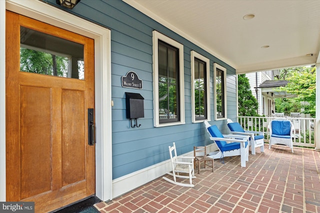 9 E Walnut St, Alexandria, VA 22301 - doorway to property with a porch