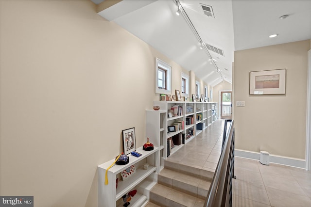 9 E Walnut St, Alexandria, VA 22301 - staircase featuring rail lighting, tile patterned flooring, and lofted ceiling