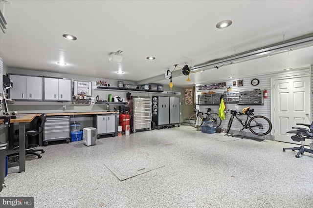 9 E Walnut St, Alexandria, VA 22301 - garage featuring a workshop area, recessed lighting, and a garage door opener