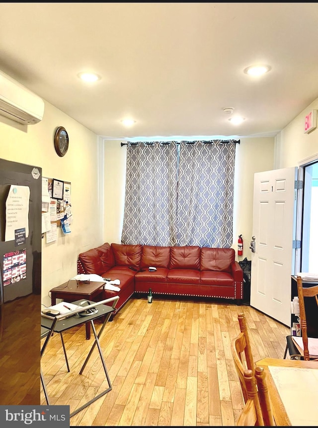 2538 N 16th St, Philadelphia, PA 19132 - living room with light wood finished floors and a wall mounted AC