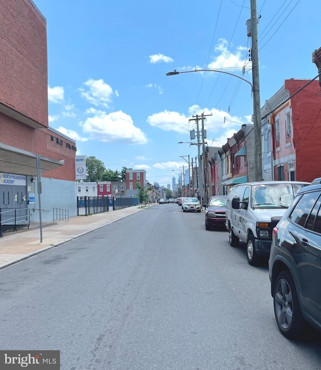 2538 N 16th St, Philadelphia, PA 19132 - view of asphalt road with street lights, sidewalks, and curbs