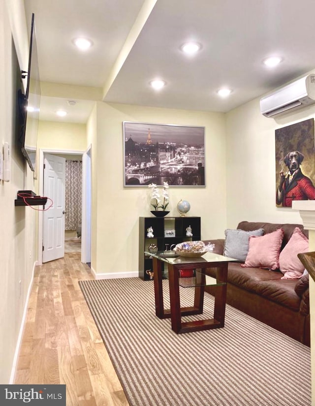 2538 N 16th St, Philadelphia, PA 19132 - living room featuring an AC wall unit, light wood-type flooring, and recessed lighting