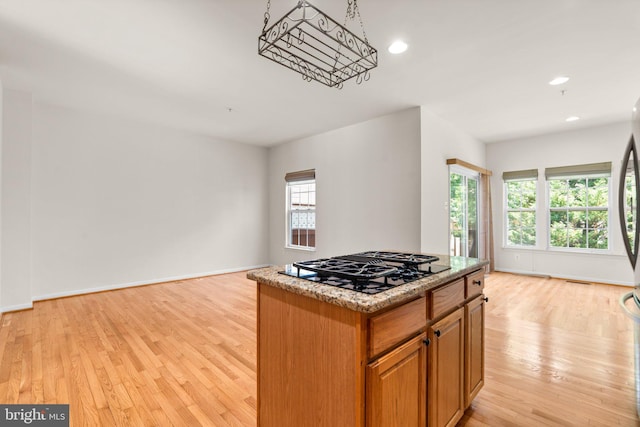 9956 Fragrant Lilies Way, Laurel, MD 20723 - kitchen with black gas stovetop, light wood-style floors, a kitchen island, and recessed lighting