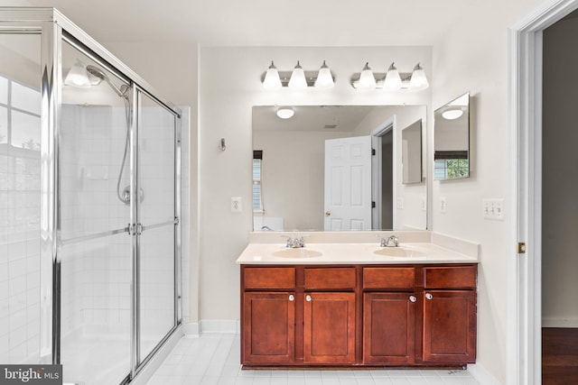 9956 Fragrant Lilies Way, Laurel, MD 20723 - full bath featuring a shower stall, double vanity, and tile patterned floors