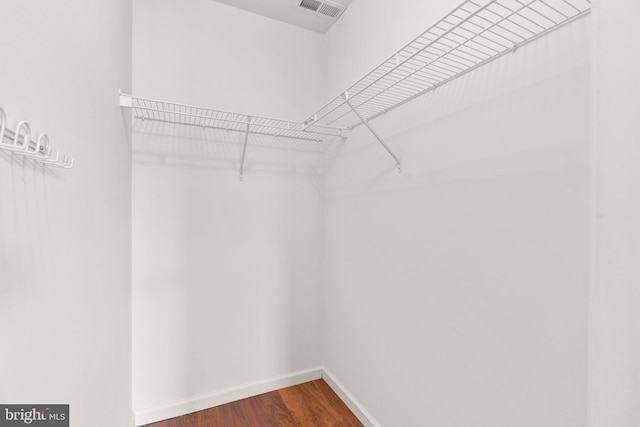 9956 Fragrant Lilies Way, Laurel, MD 20723 - walk in closet featuring dark wood-type flooring