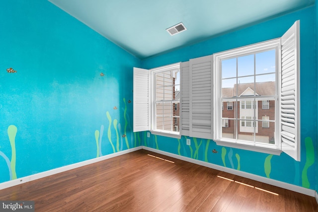 9956 Fragrant Lilies Way, Laurel, MD 20723 - empty room with wood finished floors and vaulted ceiling