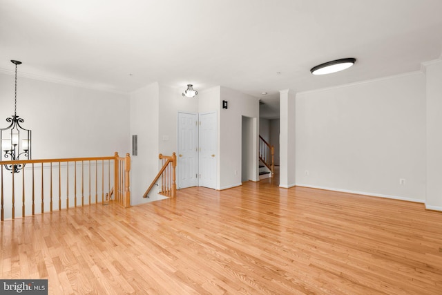 9956 Fragrant Lilies Way, Laurel, MD 20723 - spare room featuring light wood finished floors, ornamental molding, and a chandelier