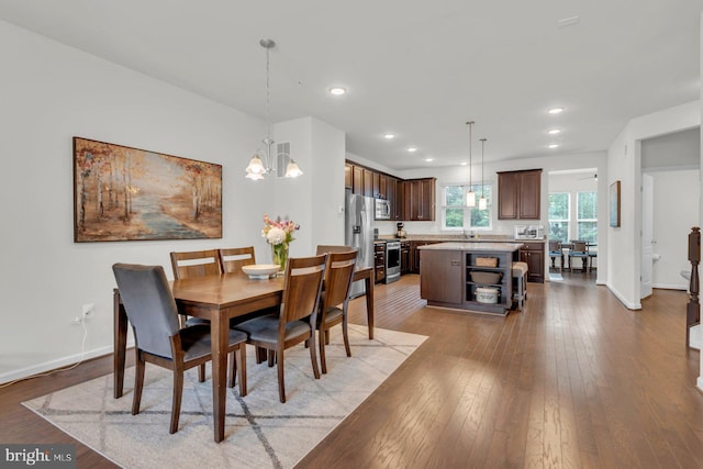 8321 Meadowood Dr, Hanover, MD 21076 - dining area featuring a chandelier, hardwood / wood-style floors, and recessed lighting