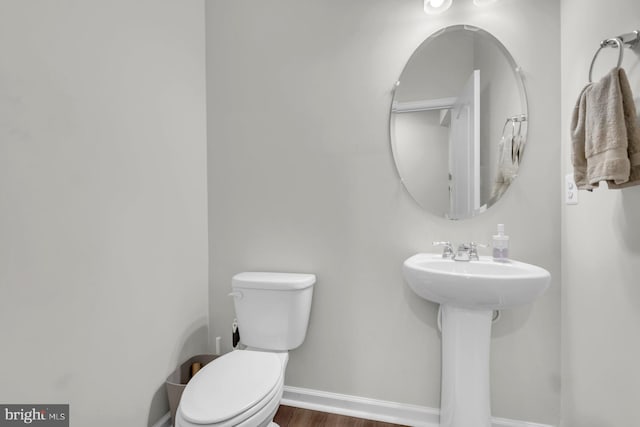 8321 Meadowood Dr, Hanover, MD 21076 - half bath featuring toilet and wood finished floors